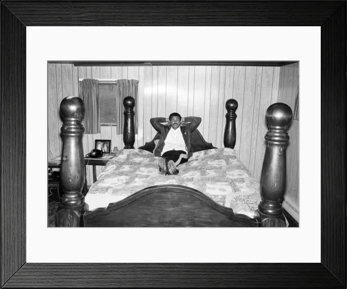 Framed Print : Muhammad Ali in training at his camp. He shows off his four poster bed. 2nd May 1980 Framed Print : Muhammad Ali in training at his camp. He shows off his four poster bed. 2nd May 1980