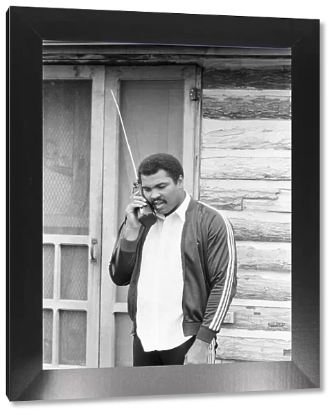 Muhammad Ali keeps in touch with friends and family from his training camp. 2nd May 1980