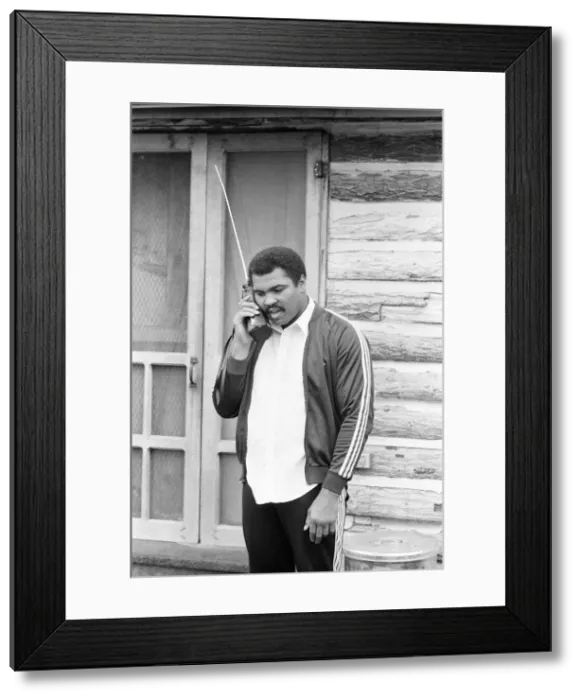 Framed Print : Muhammad Ali keeps in touch with friends and family from his training camp. 2nd May 1980