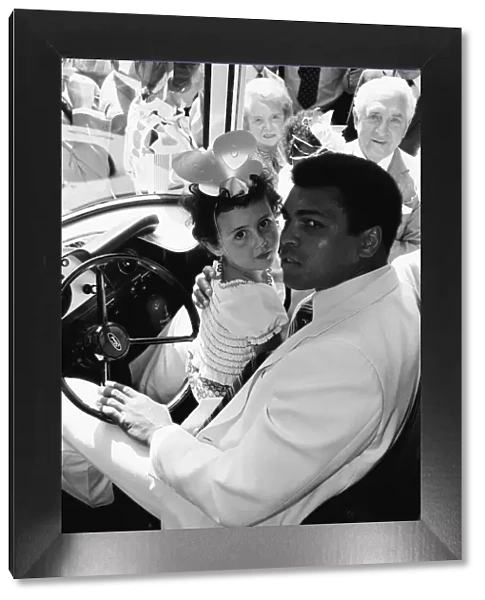 World Heavy-weight boxing champion, Muhammad Ali presented a coach on behalf of