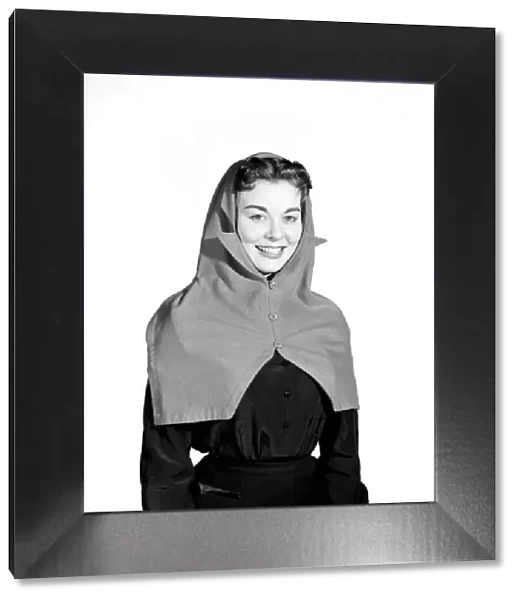 Clothing: Fashion: Hats: Woman wearing hat and scarf combined. 1958 B427-002