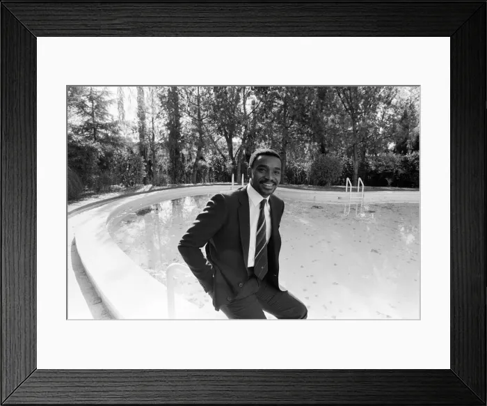 Framed Print : Laurie Cunningham poses for the camera near swimming pool Madrid Spain Framed Print : Laurie Cunningham poses for the camera near swimming pool Madrid Spain