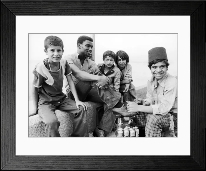 Framed Print : West Broms Laurie Cunningham in Turkey, gets a shoe shine to add some extra polish Framed Print : West Broms Laurie Cunningham in Turkey, gets a shoe shine to add some extra polish
