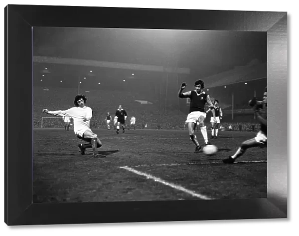 Manchester United winger Willie Morgan attempts a shot on goal at Villa Park during their