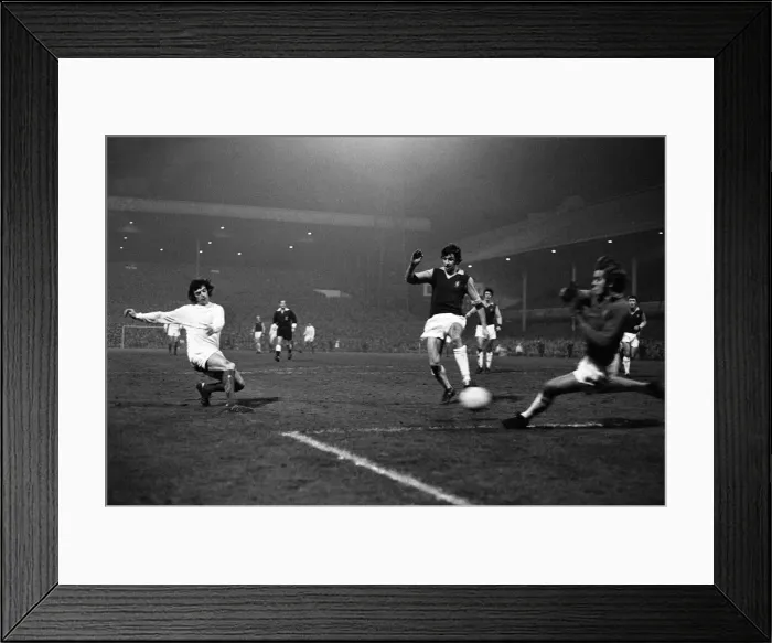 Framed Print : Manchester United winger Willie Morgan attempts a shot on goal at Villa Park during their