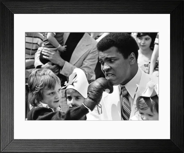 Framed Print : World heavyweight boxing champion Muhammad Ali presented a sunshine coach on the behalf