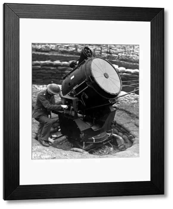 Framed Print : World War Two - Second World War - A searchlight is overhauled before nightfall at an Framed Print : World War Two - Second World War - A searchlight is overhauled before nightfall at an