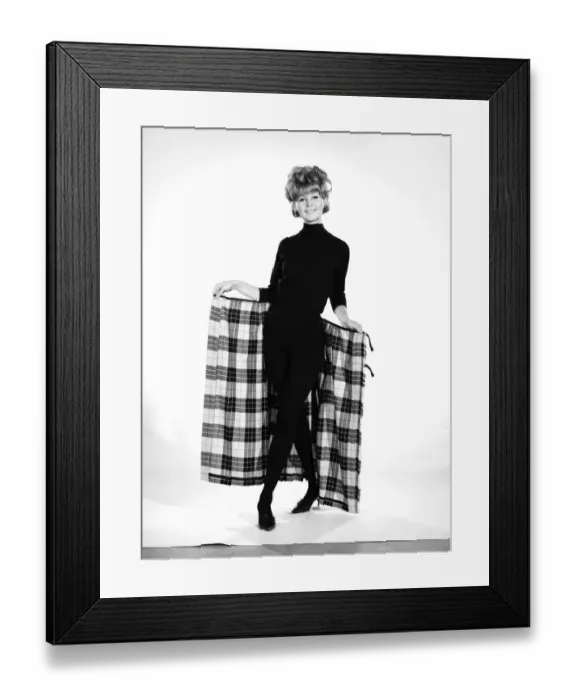Framed Print : Clothing: Fashion: Skirts: Woman wearing tartan kilt. Model: Pamela Rowe. 1964 B1843-001