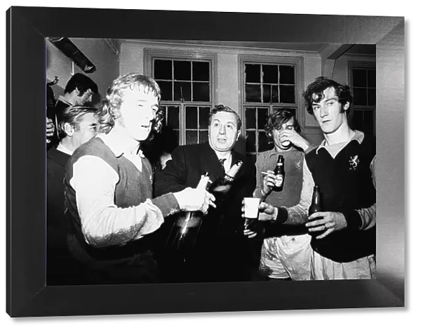 Doug Ellis seen here with members of Aston Villa celebrating in the dressing room at