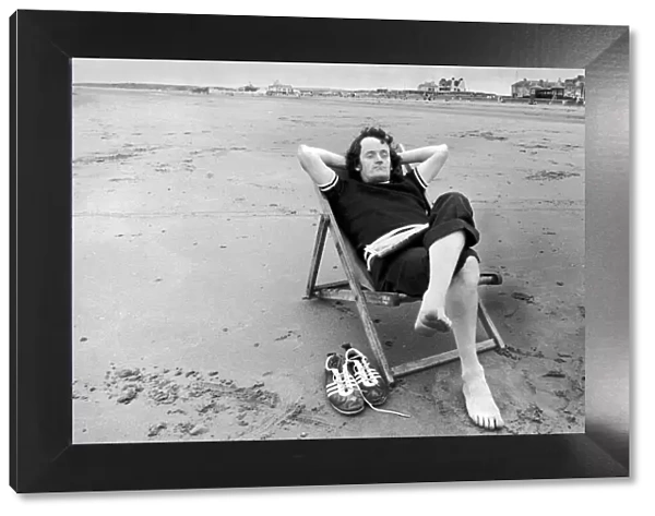 Holidaymaker Chris Murray from Govanhill, Glasgow, relaxes on the beach at Prestwick