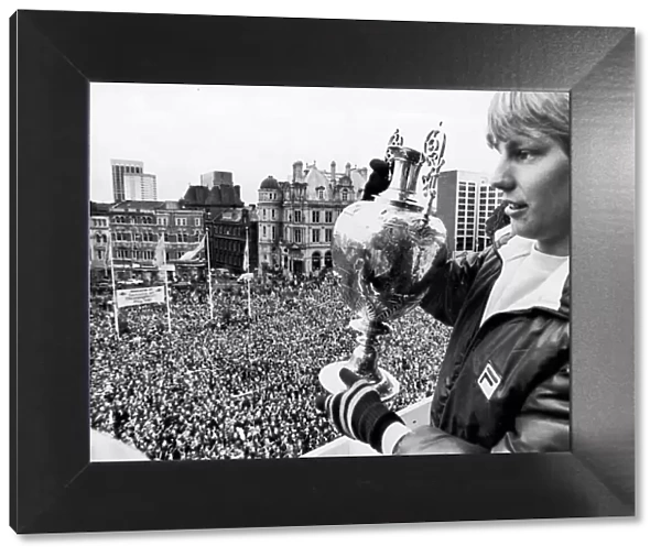 Aston Villa footballer Gary Shaw shows of the the league Championship trophy to