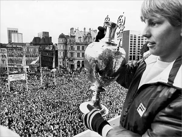 Aston Villa footballer Gary Shaw shows of the the league Championship trophy to
