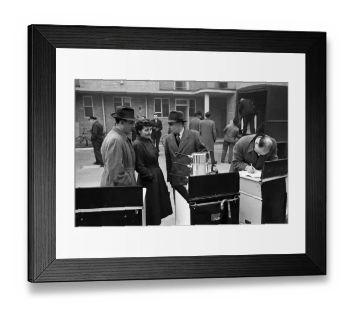 Framed Print : Door to Door Salesmen sell domestic appliances to homeowners in London Framed Print : Door to Door Salesmen sell domestic appliances to homeowners in London