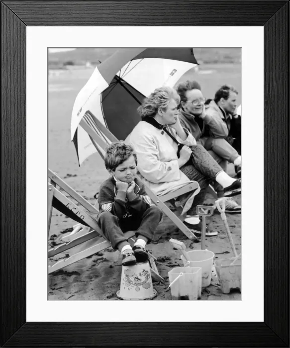 Framed Print : Ayr beach was a little to fresh for John Byrne. He looked fed up Framed Print : Ayr beach was a little to fresh for John Byrne. He looked fed up