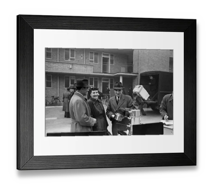 Framed Print : Door to Door Salesmen sell domestic appliances to homeowners in London Framed Print : Door to Door Salesmen sell domestic appliances to homeowners in London