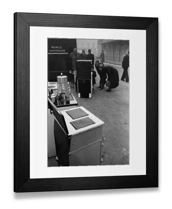 Framed Print : Door to Door Salesmen sell domestic appliances to homeowners in London Framed Print : Door to Door Salesmen sell domestic appliances to homeowners in London