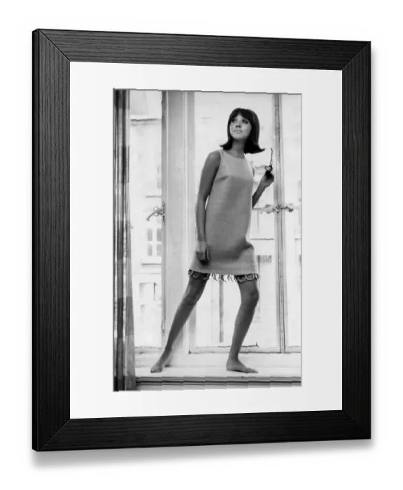 Framed Print : Clothing Fashion Beachwear: Carol long in an orange beach shift trimmed with gold curtain