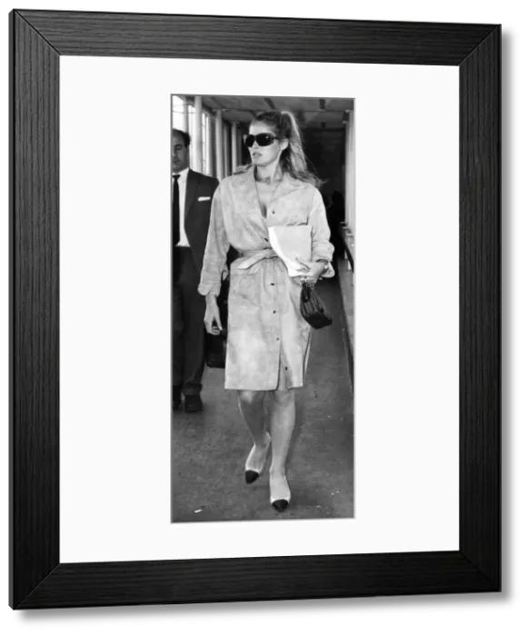 Framed Print : Ursulas Flying Fashion: Actress Ursula Andress is pictured here leaving London