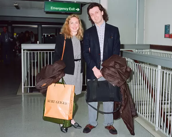 Jayne Torvill and husband Phil Christensen arrive at London Airport. 17th may 1991