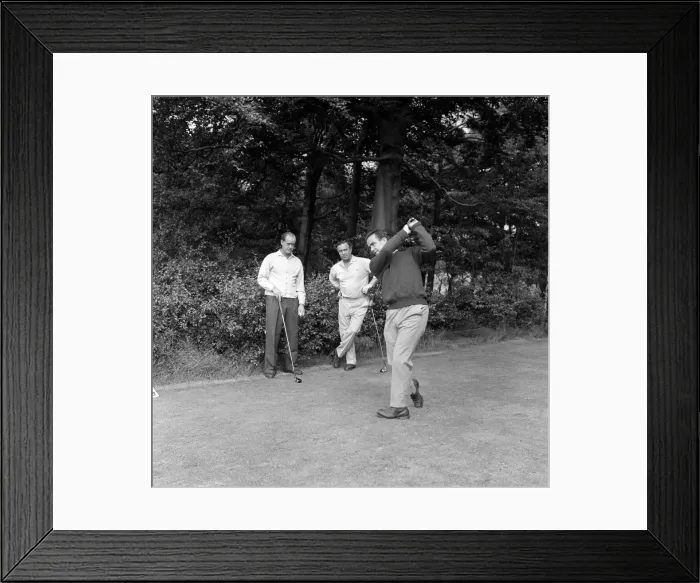 Framed Print : England cricketer Bobby Simpson enjoys a game of golf at Morton Golf Club watched by