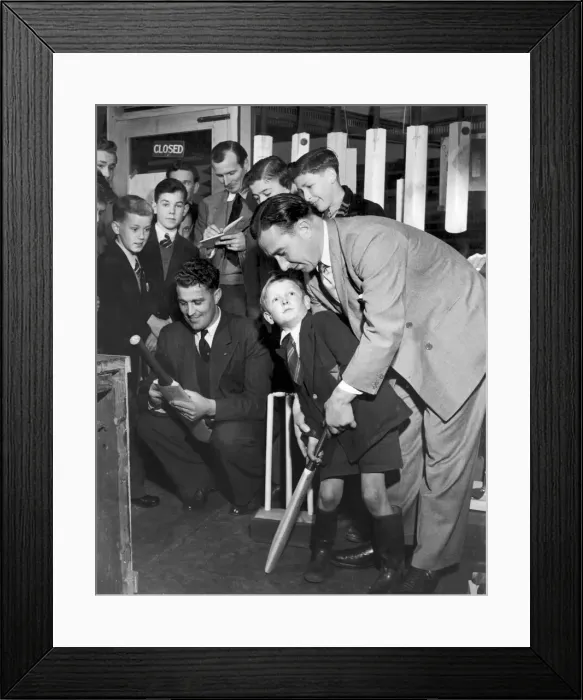 Framed Print : Denis Compton shows five year old Robin Lawrie the best way to hold a cricket bat after Framed Print : Denis Compton shows five year old Robin Lawrie the best way to hold a cricket bat after