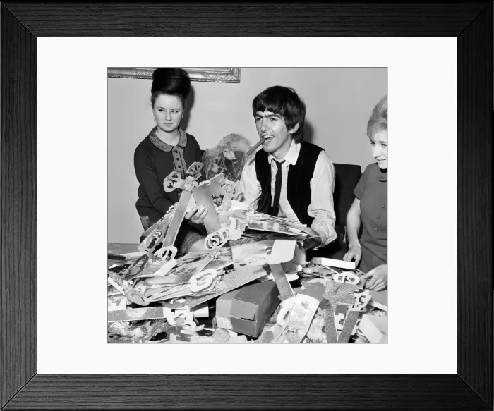 Framed Print : George Harrison, 21st birthday, with fan-club secretary Anne Collingham helping him sort Framed Print : George Harrison, 21st birthday, with fan-club secretary Anne Collingham helping him sort