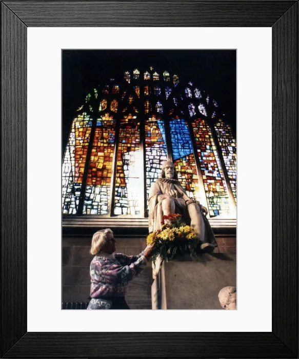 Framed Print : Joan Gage, of Stretford, puts flowers in front of one of the windows at Manchester