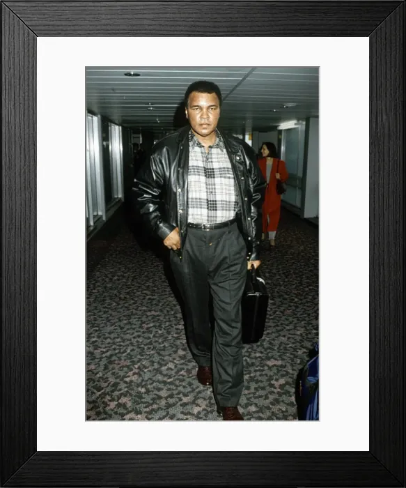 Framed Print : Muhammad Ali arriving at Heathrow Airport. 1st December 1993 Framed Print : Muhammad Ali arriving at Heathrow Airport. 1st December 1993