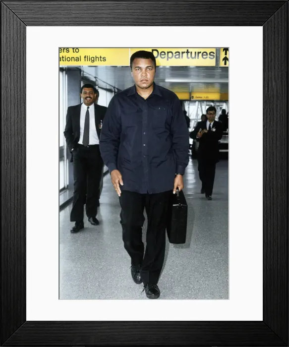 Framed Print : Muhammad Ali arriving at Heathrow Airport. 16th October 1989 Framed Print : Muhammad Ali arriving at Heathrow Airport. 16th October 1989