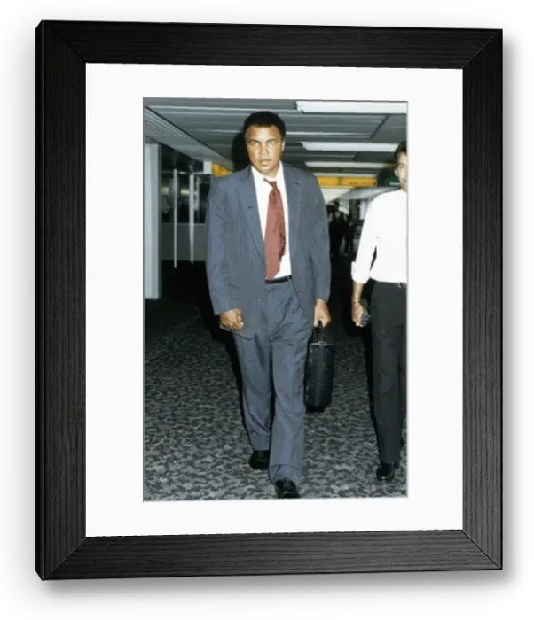 Framed Print : Muhammad Ali arriving at Heathrow airport after visiting war victims in Iran Framed Print : Muhammad Ali arriving at Heathrow airport after visiting war victims in Iran