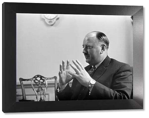 Dr Richard Beeching, Chairman of British Railways, pictured in his office