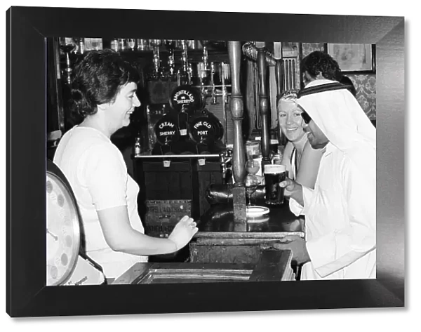 Arab man enjoying a pint of Guinness at the Stanhope public house on Gloucester Road