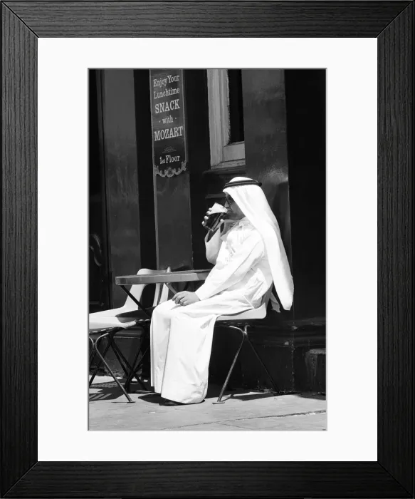 Framed Print : Arab man sitting outside enjoying a pint of Guinness at the Stanhope public house Framed Print : Arab man sitting outside enjoying a pint of Guinness at the Stanhope public house