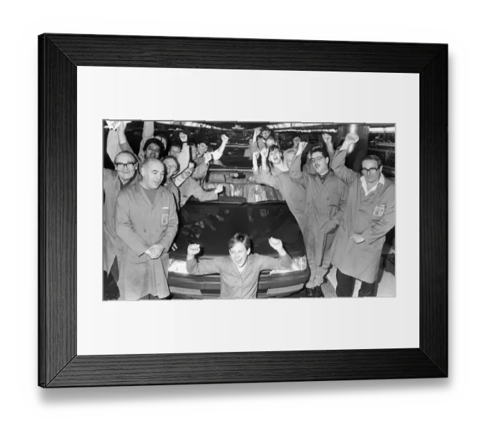 Framed Print : Production line workers at the Peugeot factory at Ryton are seen here celebrating the Car