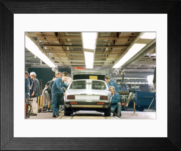 Framed Print : The last Jaguar XJ6 to be built on the old production line reaches the end of the track