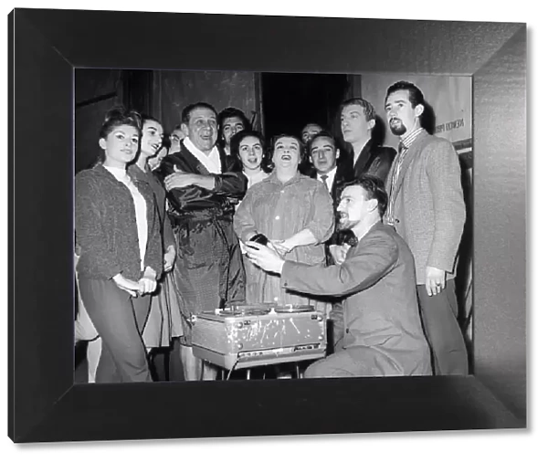 Jimmy Hill of Coventry City seen here with Sid James and the cast of Puss in Boots record