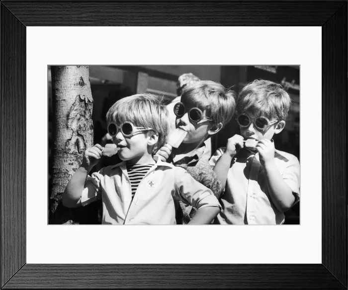 Framed Print : Three boys keep their cool with an ice lolly in Coventry City Centre Framed Print : Three boys keep their cool with an ice lolly in Coventry City Centre