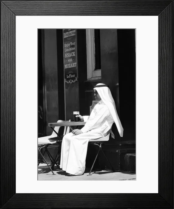 Framed Print : Arab man sitting outside enjoying a pint of Guinness at the Stanhope public house Framed Print : Arab man sitting outside enjoying a pint of Guinness at the Stanhope public house