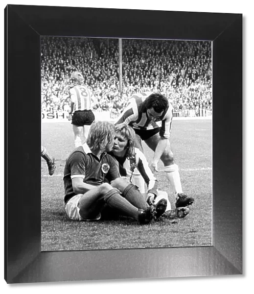 Leicester City footballer Alan Birchenall kisses and makes up with Tony Currie of