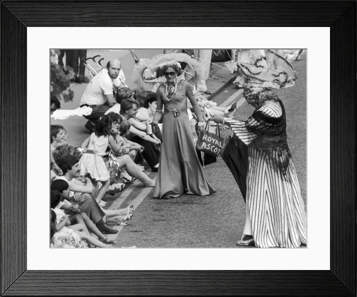 Framed Print : Charity collectors in Ascot racegoers outfits with outlandish hats charm the crowds Framed Print : Charity collectors in Ascot racegoers outfits with outlandish hats charm the crowds