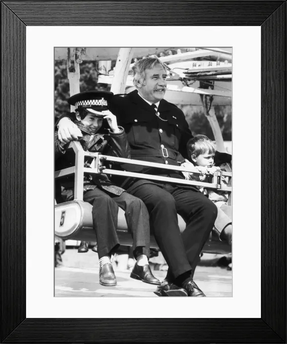 Framed Print : In safe hands of the law... Jason Lawson (left) aged 10 and Scott Marsdon aged 3