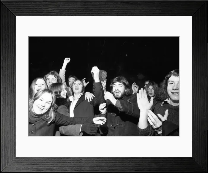 Framed Print : A happy crowd of young people greet the New Year in high-spirits in Broadgate, Coventry