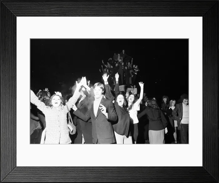 Framed Print : A happy crowd of young people greet the New Year in high-spirits in Broadgate, Coventry