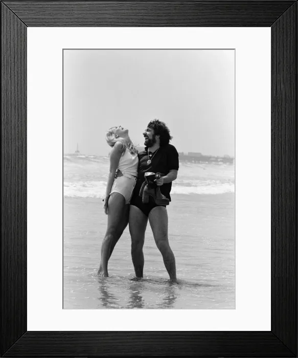 Framed Print : Keith Moon, drummer of The Who rock group with model Annette Lax in the resort of Malibu