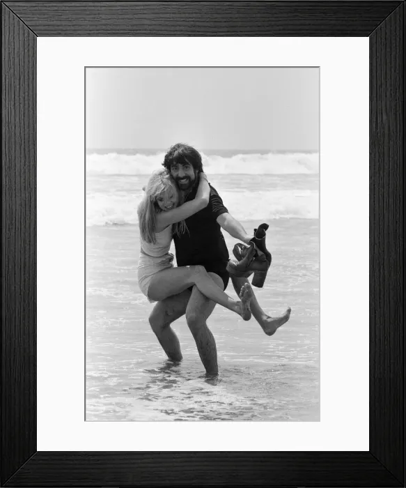 Framed Print : Keith Moon, drummer of The Who rock group with model Annette Lax in the resort of Malibu