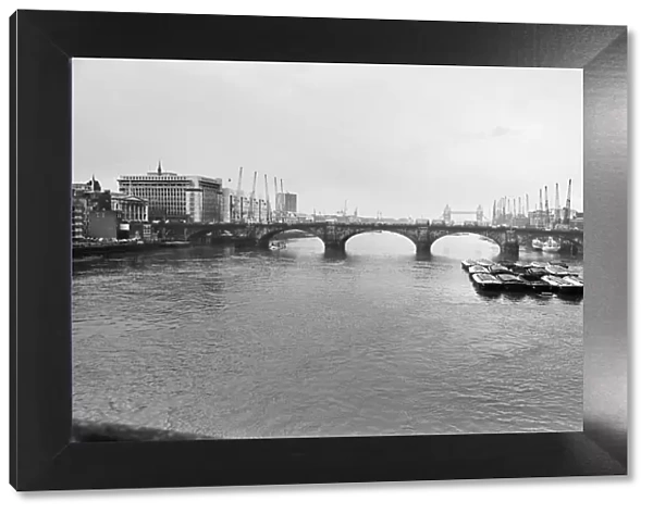 Old London Bridge, across The River Thames, London. Picture is looking down river
