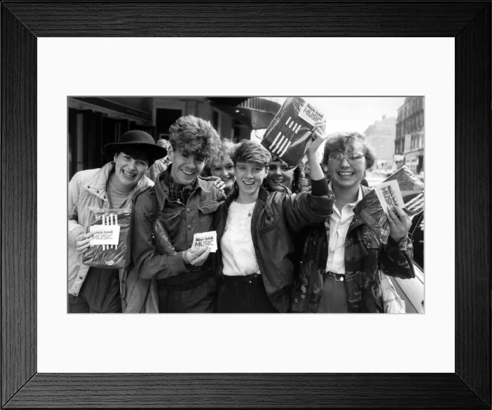Framed Print : Fans of Simple Minds, Rock Group, celebrate after managing to purchase tickets for their