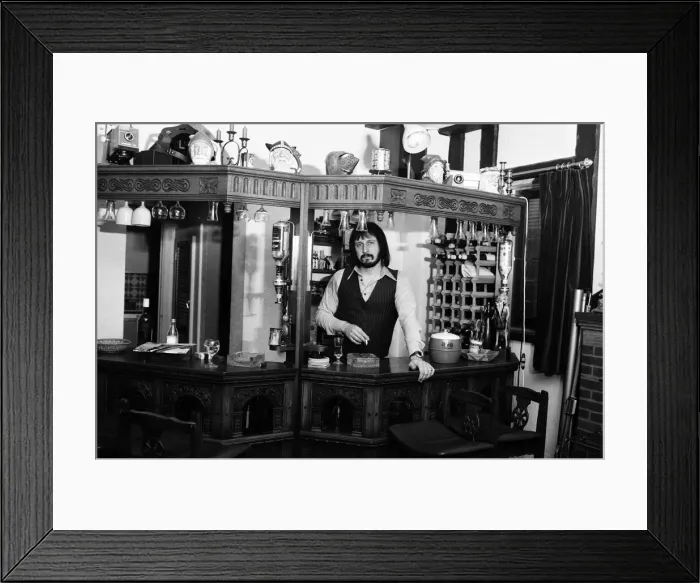 Framed Print : Bass guitarist of The Who rock group John Entwistle pictured at his home in Ealing