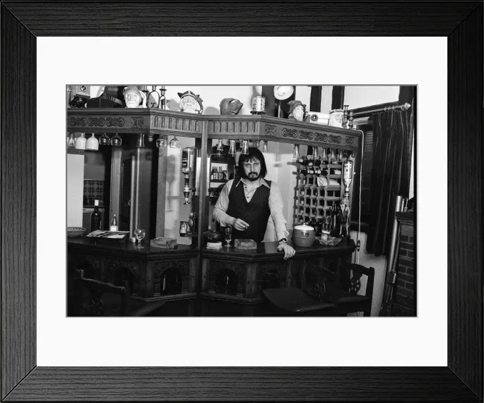 Framed Print : Bass guitarist of The Who rock group John Entwistle pictured at his home in Ealing