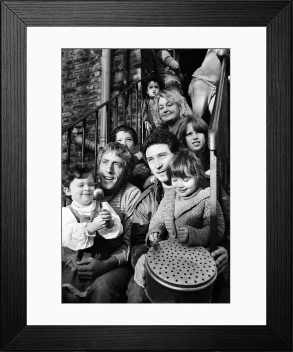 Framed Print : Roger Daltrey and Kenney Jones of the Who rock group visit Chiswick Family Rescue Home